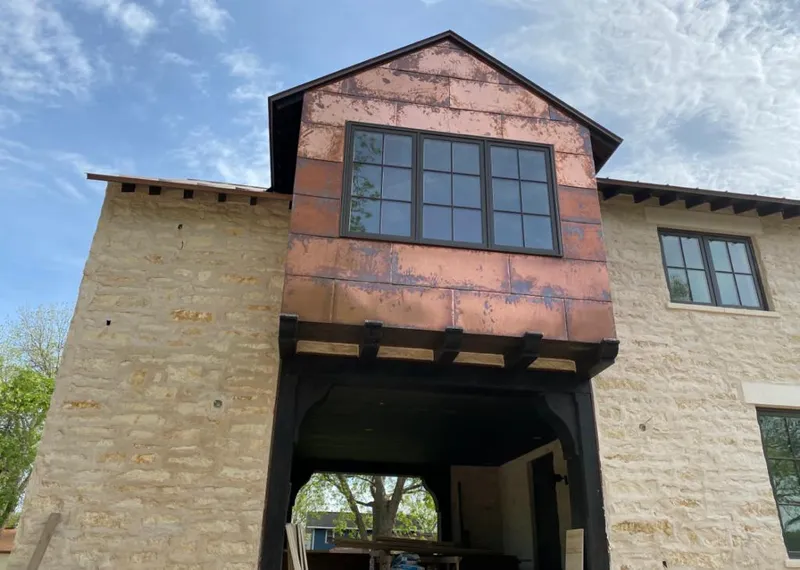 Copper metal panel facade on a stone building for Metal Roof Coating in Middle
